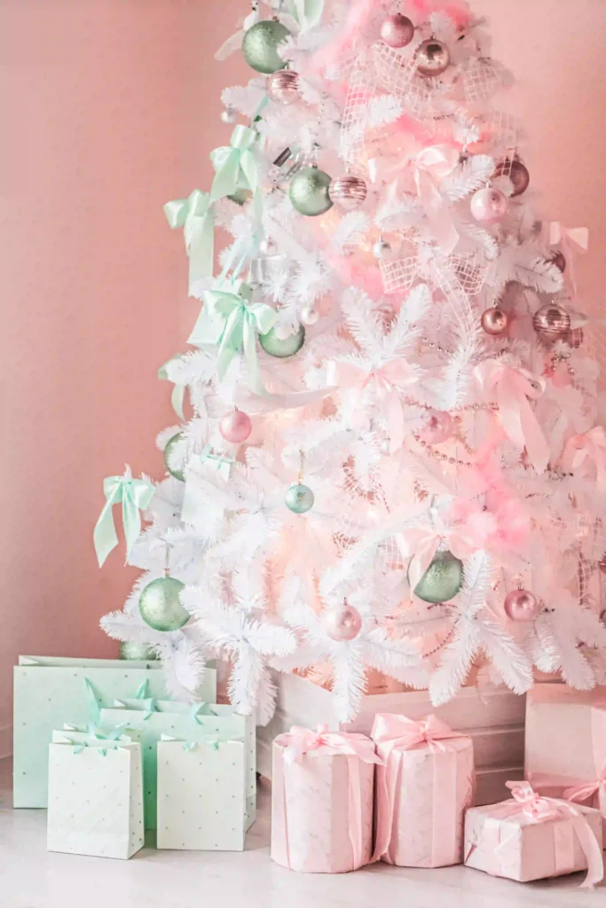 Flocked Christmas Tree Decorating Ideas featuring blush pink and gold color palette for cohesive holiday decor