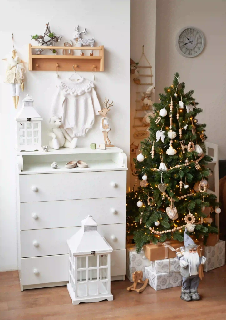 Modern minimalist white Christmas tree styling with wooden beads and sheer ribbon