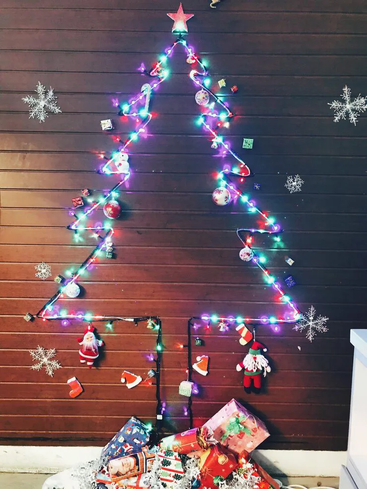 DIY Christmas Tree Ideas For The Wall with garlands and string lights