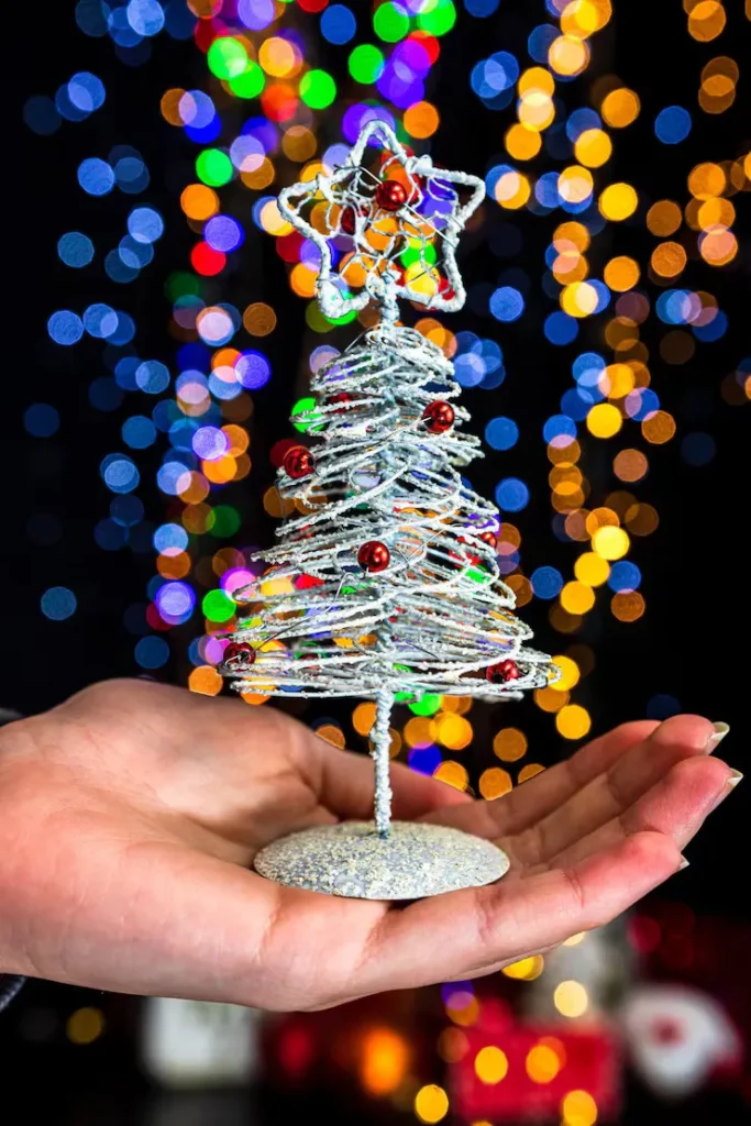 Designer wrapping Christmas tree lights layering technique