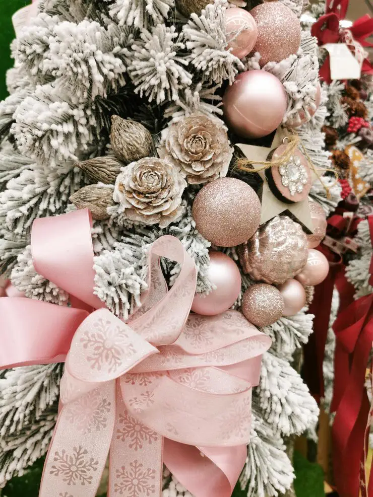 Expert tips for decorating a Pink Christmas Tree with layered ornaments and lights