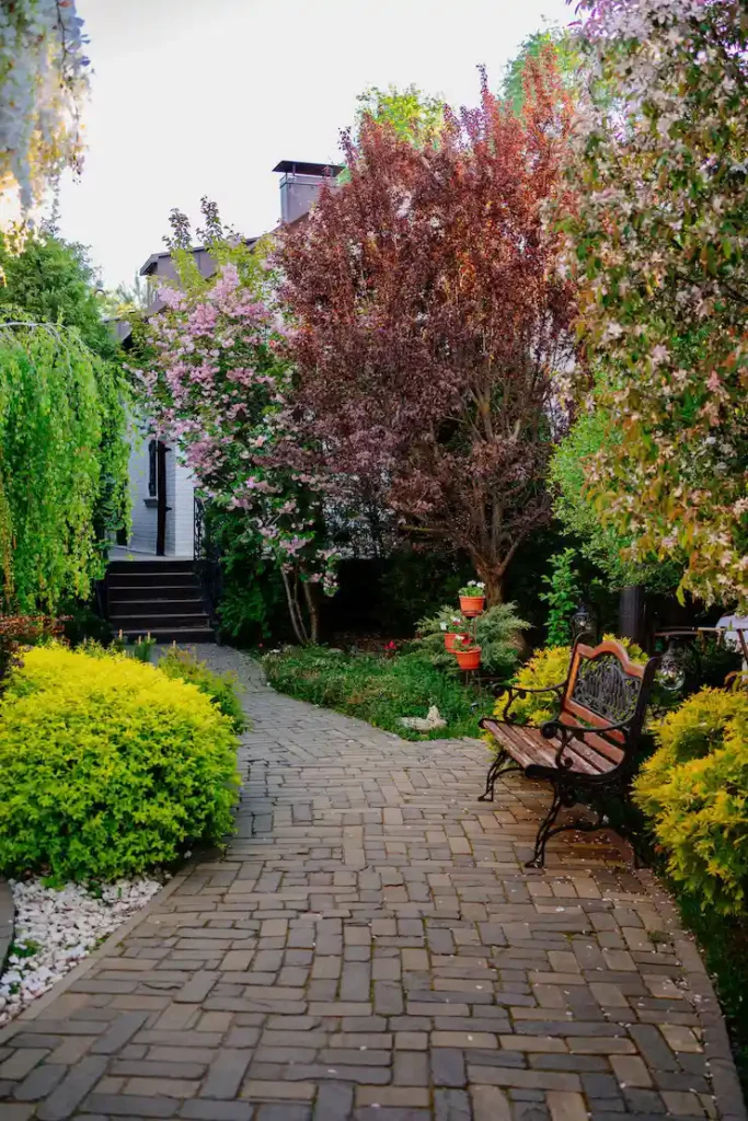 Sims 4 landscaping ideas backyard garden with flowers and pathways